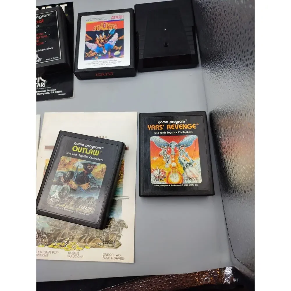 Atari 2600 Video Game Cartridge Lot of 11 Plus Storage Case PAC Man Outlaw Etc